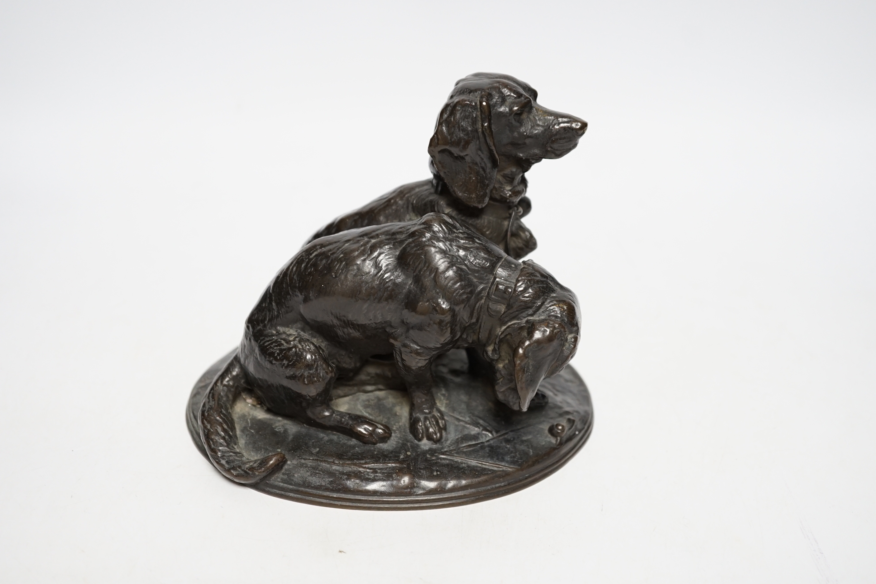 After Emmanuel Fremiet (1824-1910), a bronze group of spaniels, 14cm